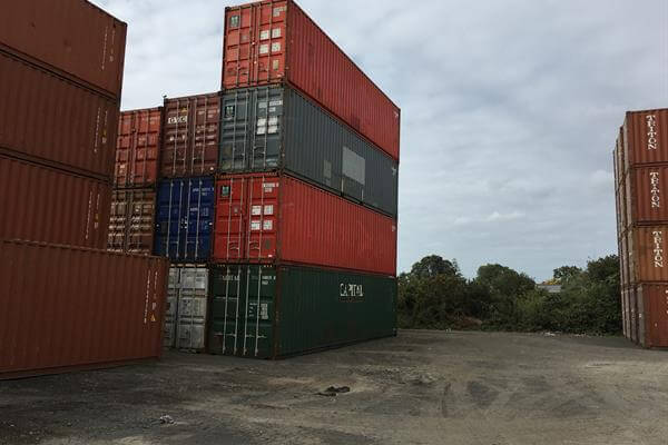 A stack of used & new shipping containers in Dunedin depot