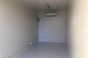 Insulated shipping container modified for Tegel storage.