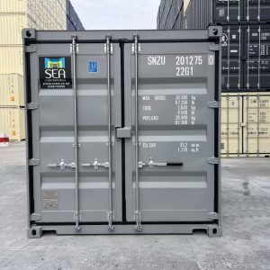Grey 20ft new build container with doors shut in a depot