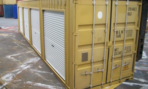 Yellow high cube shipping container with multiple roller doors